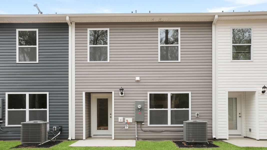 Exterior details and patio area of a home in Chestnut Ridge Townhomes, Greenville (Image 3).