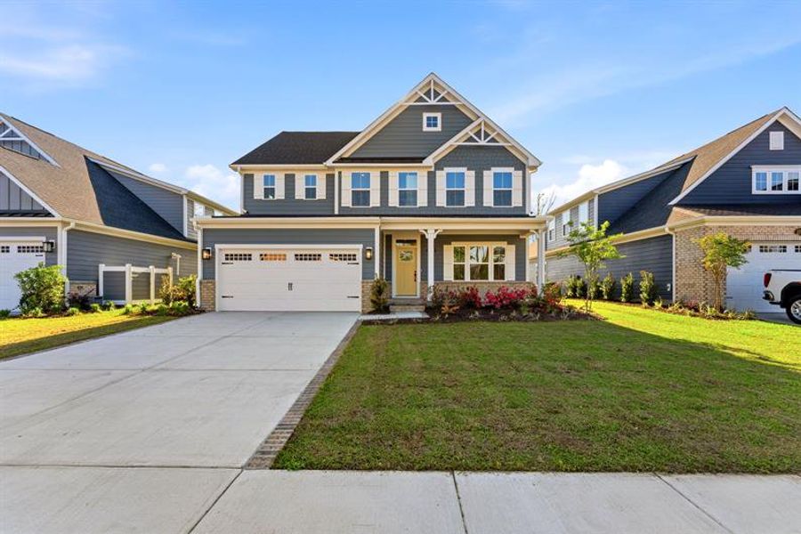 Front exterior of a new home in Grande Dunes North Village, Myrtle Beach, SC, highlighting curb appeal (Image 1). Front exterior of a new home in Grande Dunes North Village, Myrtle Beach, SC, highlighting curb appeal (Image 1).