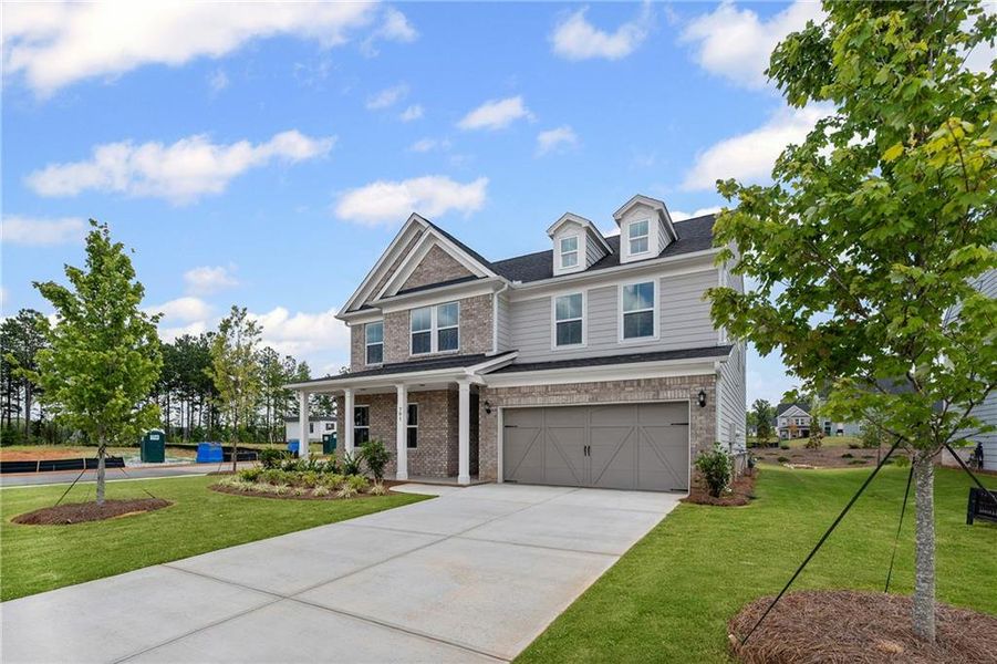 Front exterior of a new home in Hawthorne Ridge, McDonough, GA, highlighting curb appeal (Image 19). Front exterior of a new home in Hawthorne Ridge, McDonough, GA, highlighting curb appeal (Image 19).