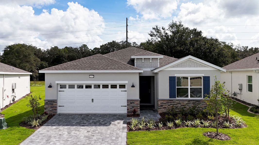 Front exterior of a new home in Lakes of Mount Dora, Mount Dora, FL, highlighting curb appeal (Image 1). Front exterior of a new home in Lakes of Mount Dora, Mount Dora, FL, highlighting curb appeal (Image 1).