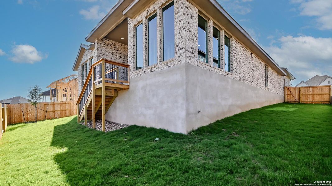 Front exterior of a new home in Homestead 65', Schertz, TX, highlighting curb appeal (Image 25). Front exterior of a new home in Homestead 65', Schertz, TX, highlighting curb appeal (Image 25).