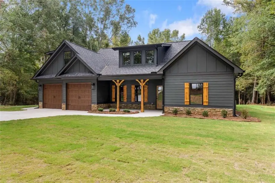 Front exterior of a new home in , Bowdon, GA, highlighting curb appeal (Image 23).