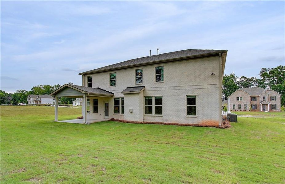 Exterior details and patio area of a home in Cambria at Traditions, Hampton (Image 16).