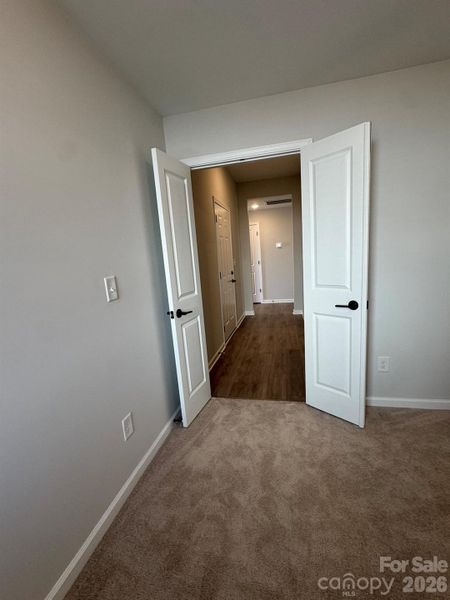 Sitting room in primary suite also connects to garage entry hall Sitting room in primary suite also connects to garage entry hall