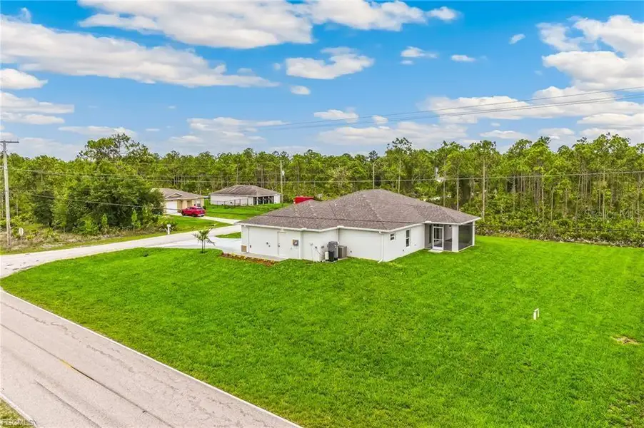 Front exterior of a new home in , Punta Gorda, FL, highlighting curb appeal (Image 2).