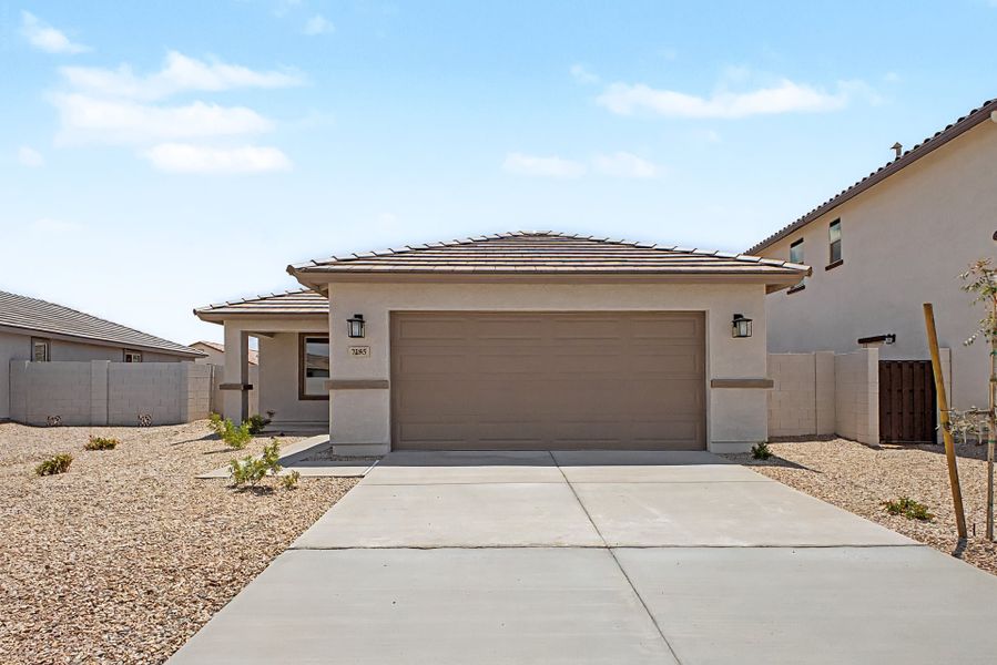 Front exterior of a new home in Wildera, San Tan Valley, AZ, highlighting curb appeal (Image 2). Front exterior of a new home in Wildera, San Tan Valley, AZ, highlighting curb appeal (Image 2).