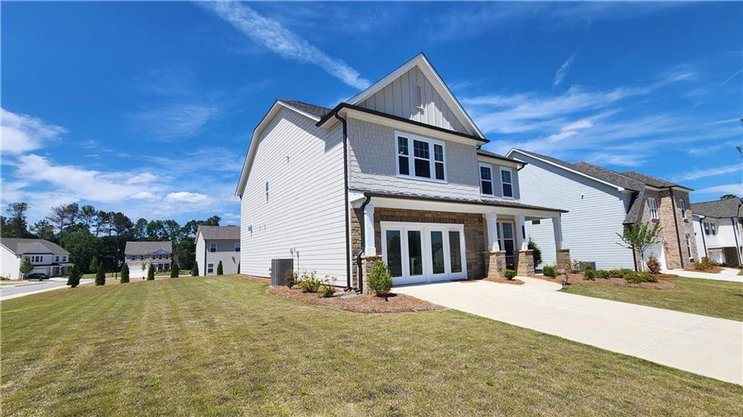 Front exterior of a new home in The Estates at Casteel, Bethlehem, GA, highlighting curb appeal (Image 23). Front exterior of a new home in The Estates at Casteel, Bethlehem, GA, highlighting curb appeal (Image 23).