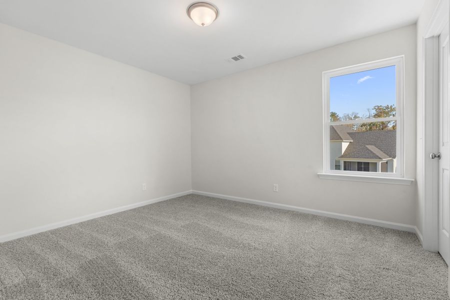 Representative unfurnished interior of a home built from the The Dalton by Smith Family Homes in Ramsey Landing, Rincon (Image 22).