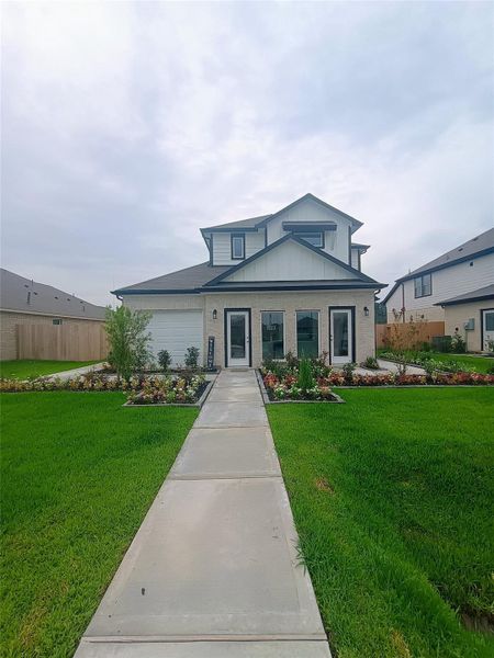 Front exterior of a new home in Enclave at Willis, Willis, TX, highlighting curb appeal (Image 25). Front exterior of a new home in Enclave at Willis, Willis, TX, highlighting curb appeal (Image 25).
