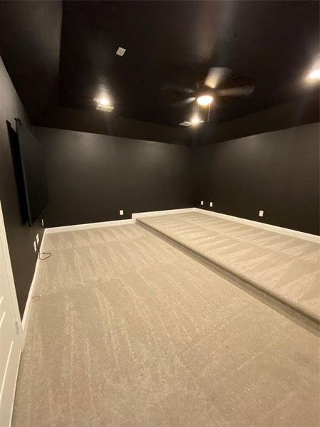 Empty room with carpet floors, ceiling fan, and recessed lighting Empty room with carpet floors, ceiling fan, and recessed lighting