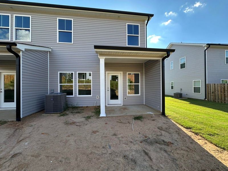 Exterior details and patio area of a home in Windsor Townhomes, North Augusta (Image 3). Exterior details and patio area of a home in Windsor Townhomes, North Augusta (Image 3).
