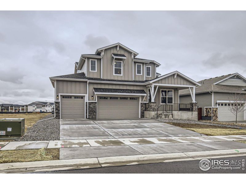 Front exterior of a new home in RainDance - 60s, Windsor, CO, highlighting curb appeal (Image 23).