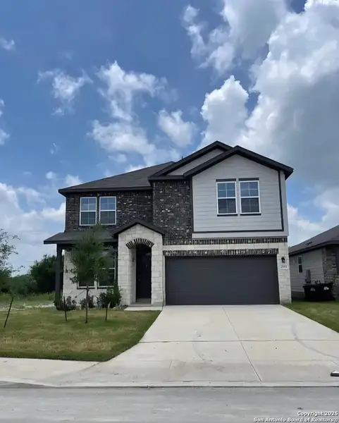 Front exterior of a new home in Hunter's Ranch, San Antonio, TX, highlighting curb appeal (Image 1). Front exterior of a new home in Hunter's Ranch, San Antonio, TX, highlighting curb appeal (Image 1).