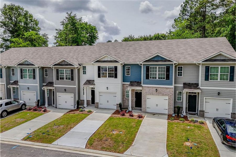 Front exterior of a new home in Old Summerville Village, Rome, GA, highlighting curb appeal (Image 2). Front exterior of a new home in Old Summerville Village, Rome, GA, highlighting curb appeal (Image 2).