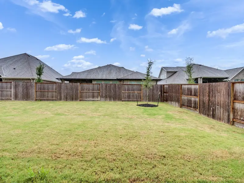 Exterior details and patio area of a home in Meridiana, Manvel (Image 3).