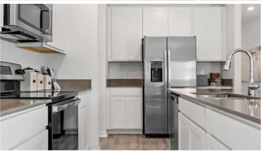 Furnished interior view inside a new home in Cascades: Legacy Collection, Davenport (Image 3).