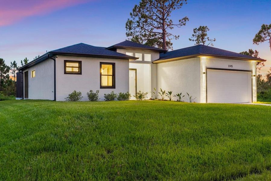 Front exterior of a new home in , Port Charlotte, FL, highlighting curb appeal (Image 32). Front exterior of a new home in , Port Charlotte, FL, highlighting curb appeal (Image 32).