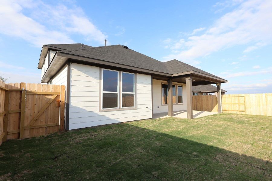 Exterior details and patio area of a home in Mason Woods, Cypress (Image 19).
