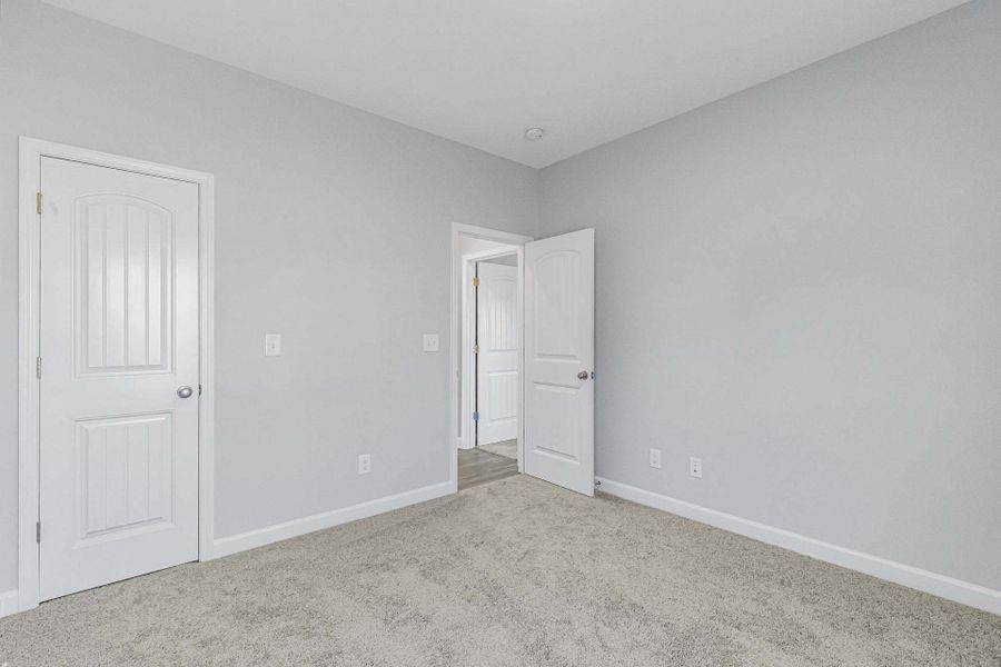 Representative unfurnished interior of a home built from the Weymouth by Caviness & Cates Communities in Bartlett Manor, Youngsville (Image 157).