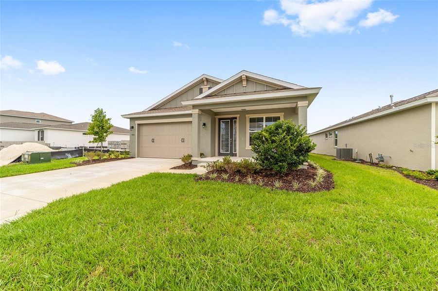 Front exterior of a new home in Calesa Township, Ocala, FL, highlighting curb appeal (Image 2). Front exterior of a new home in Calesa Township, Ocala, FL, highlighting curb appeal (Image 2).