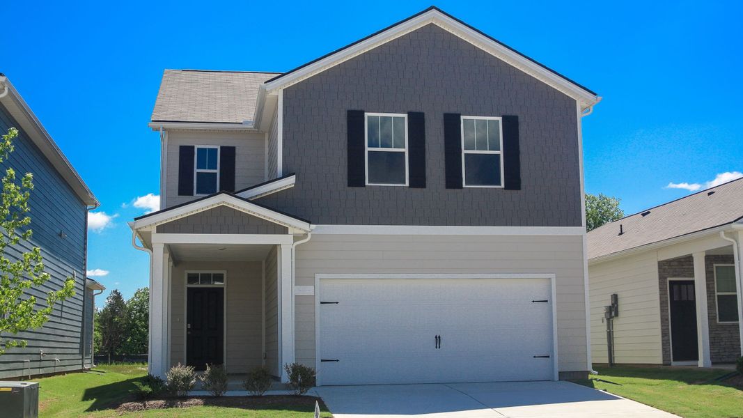 Front exterior of a new home in Percy Cove, Antioch, TN, highlighting curb appeal (Image 1). Front exterior of a new home in Percy Cove, Antioch, TN, highlighting curb appeal (Image 1).