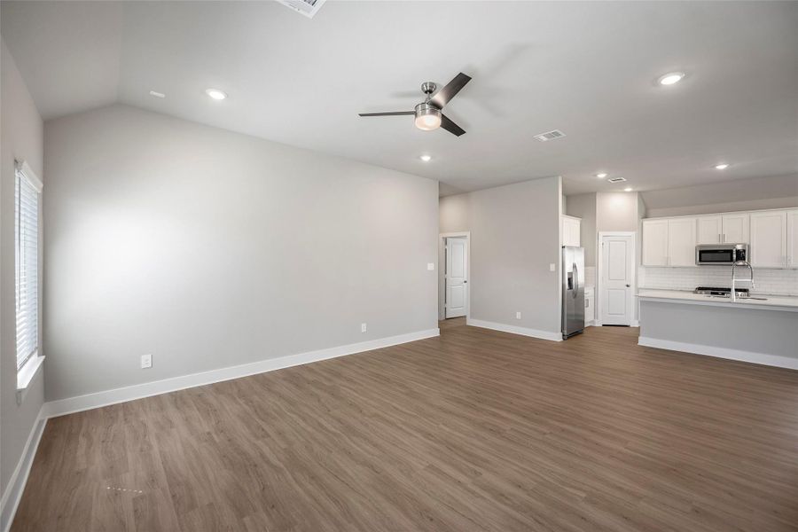 Spacious family room offering an open layout perfect for gatherings or relaxing evenings.