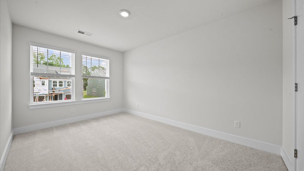 First-rate bedroom with plush carpeting and large windows that provide an open, airy feel First-rate bedroom with plush carpeting and large windows that provide an open, airy feel