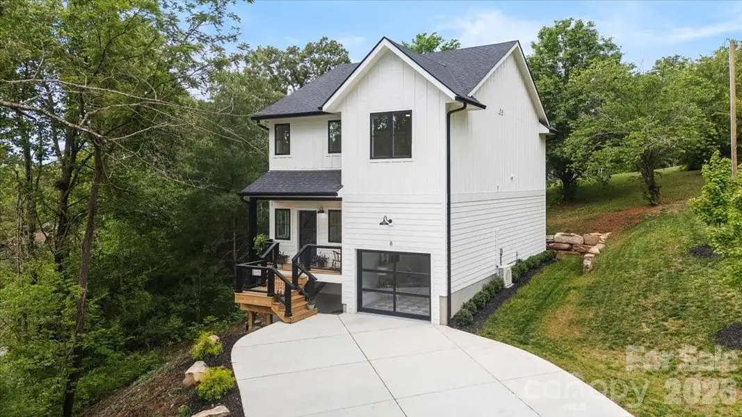 Front exterior of a new home in , Weaverville, NC, highlighting curb appeal (Image 2). Front exterior of a new home in , Weaverville, NC, highlighting curb appeal (Image 2).