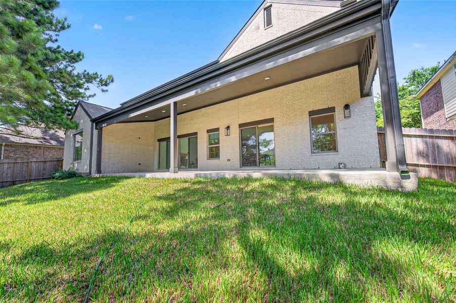 Exterior details and patio area of a home in , Conroe (Image 25).
