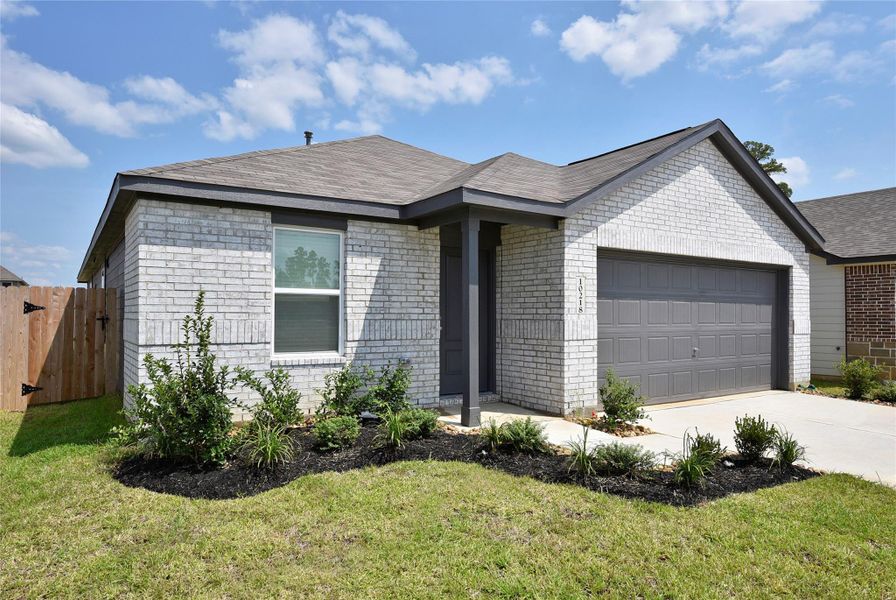 Front exterior of a new home in Grand Oaks Reserve, Cleveland, TX, highlighting curb appeal (Image 2). Front exterior of a new home in Grand Oaks Reserve, Cleveland, TX, highlighting curb appeal (Image 2).