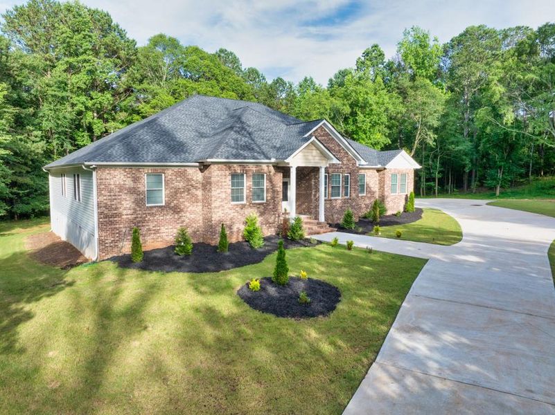 Front exterior of a new home in , Oxford, GA, highlighting curb appeal (Image 29). Front exterior of a new home in , Oxford, GA, highlighting curb appeal (Image 29).