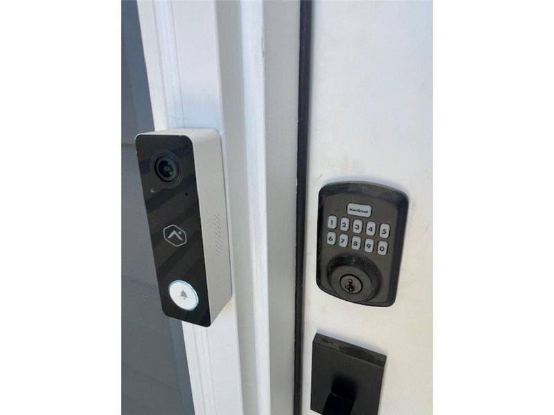 Secure entry features a smart doorbell and a keyle