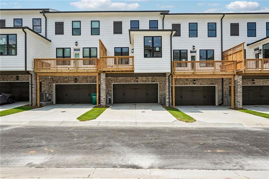 Front exterior of a new home in Millcroft Townhomes, Buford, GA, highlighting curb appeal (Image 32). Front exterior of a new home in Millcroft Townhomes, Buford, GA, highlighting curb appeal (Image 32).