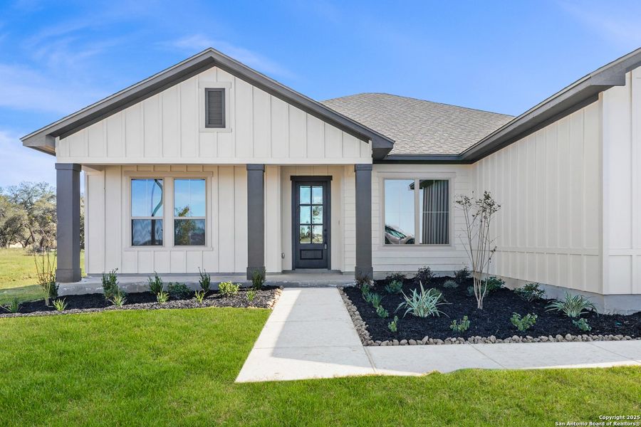 Front exterior of a new home in Pradera Ridge, Floresville, TX, highlighting curb appeal (Image 22). Front exterior of a new home in Pradera Ridge, Floresville, TX, highlighting curb appeal (Image 22).