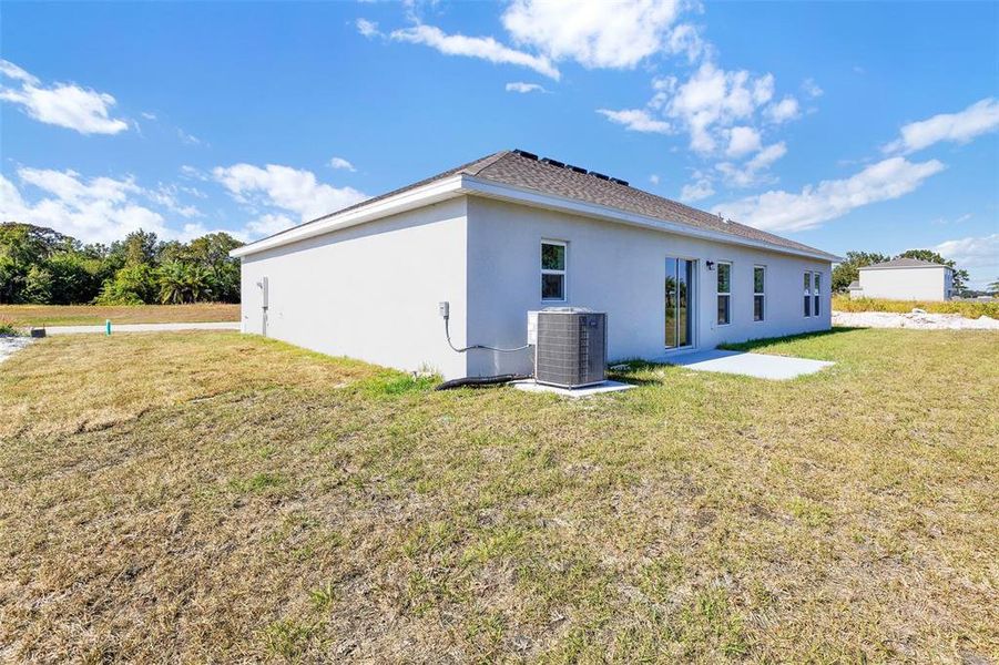 Exterior details and patio area of a home in Grand Oaks, Avon Park (Image 12).