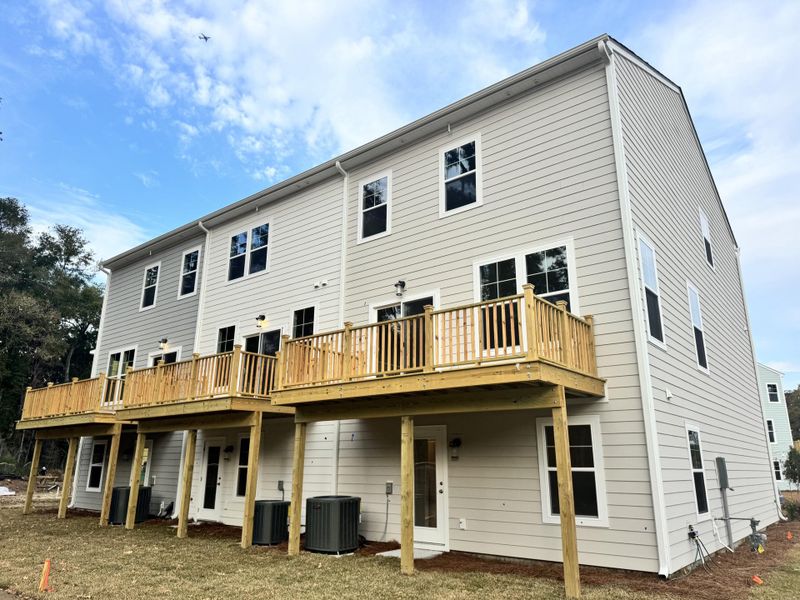 Exterior details and patio area of a home in Indigo Grove Townhomes, Johns Island (Image 21).