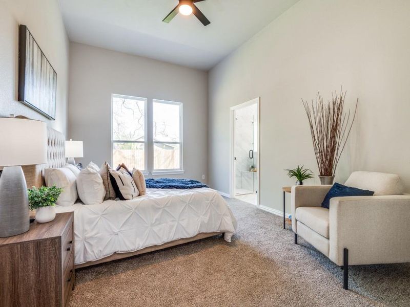 Bedroom with ensuite bathroom, baseboards, a ceiling fan, and carpet floors Bedroom with ensuite bathroom, baseboards, a ceiling fan, and carpet floors