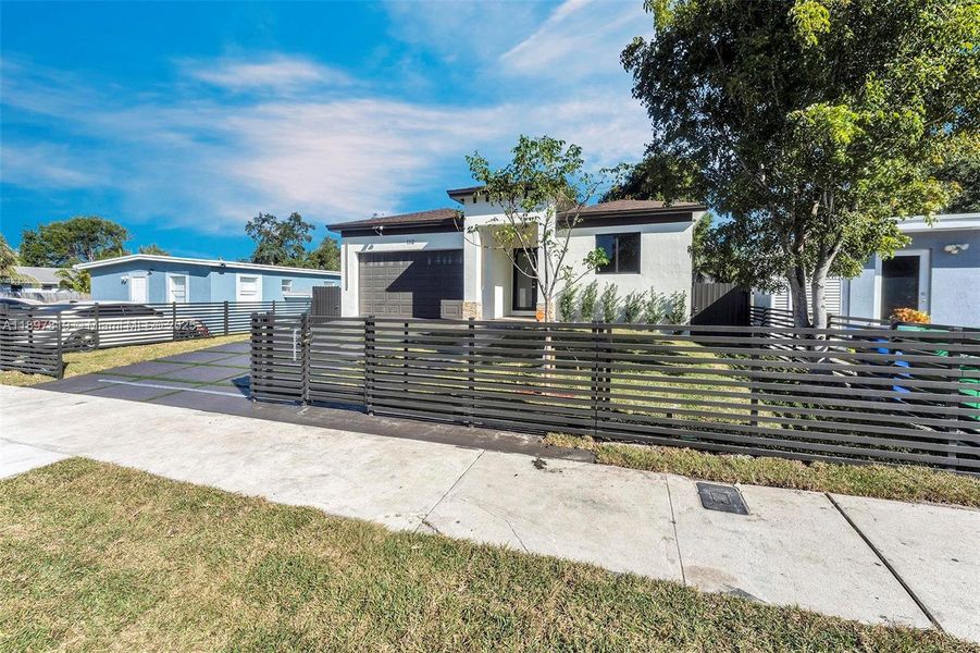 Front exterior of a new home in , North Miami, FL, highlighting curb appeal (Image 18).