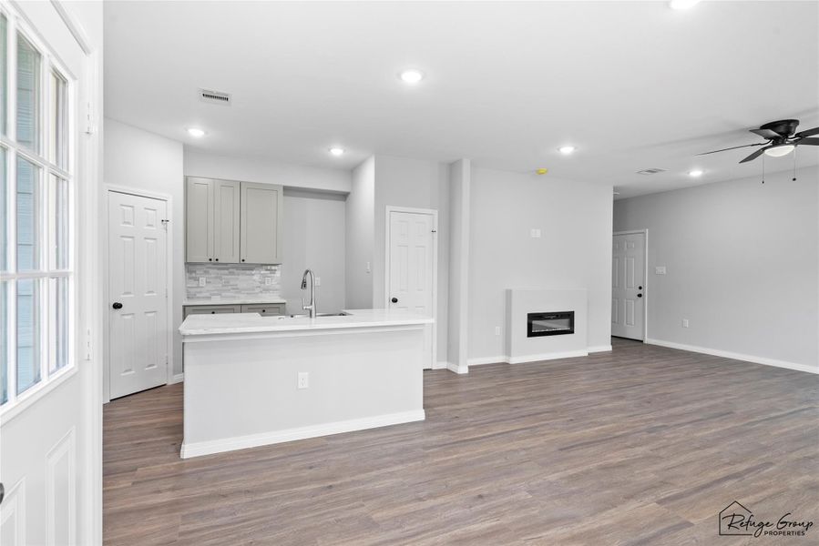 Kitchen and partial living room from dining area Kitchen and partial living room from dining area