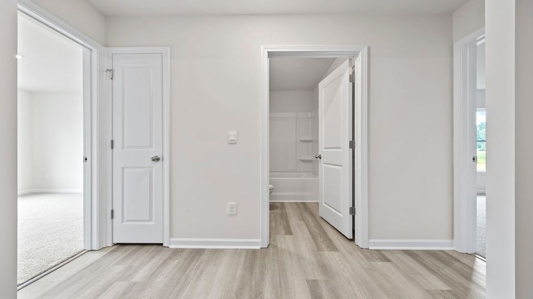 Spacious, unfurnished interior of a new home in Bentley Park, Greenwood (Image 13).