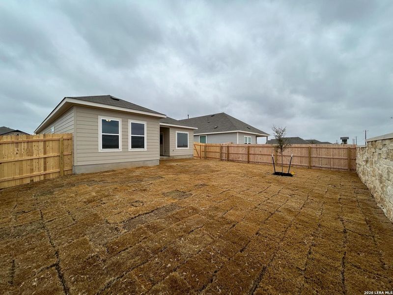 Exterior details and patio area of a home in Hennersby Hollow, San Antonio (Image 21).