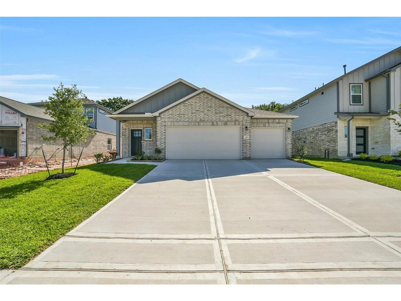 Front exterior of a new home in Windmill Estates, Magnolia, TX, highlighting curb appeal (Image 1). Front exterior of a new home in Windmill Estates, Magnolia, TX, highlighting curb appeal (Image 1).