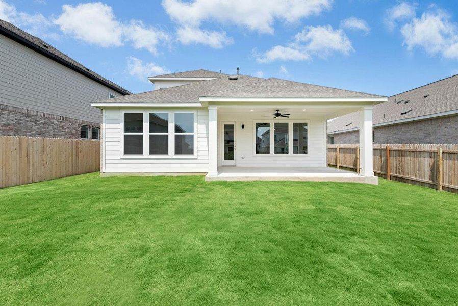 Front exterior of a new home in Santa Rita Ranch, Liberty Hill, TX, highlighting curb appeal (Image 17). Front exterior of a new home in Santa Rita Ranch, Liberty Hill, TX, highlighting curb appeal (Image 17).