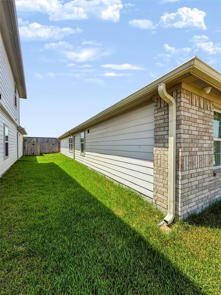 Exterior details and patio area of a home in Windstone on the Prairie, Richmond (Image 3).