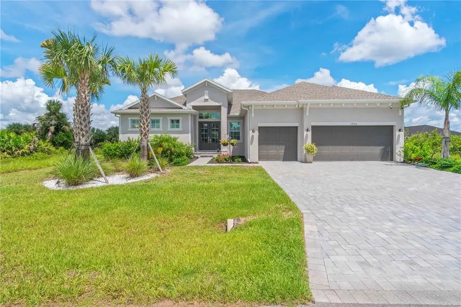 Front exterior of a new home in , Port Charlotte, FL, highlighting curb appeal (Image 2). Front exterior of a new home in , Port Charlotte, FL, highlighting curb appeal (Image 2).