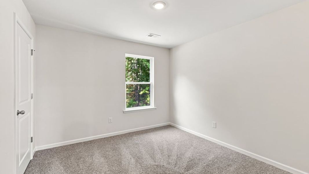 Spacious, unfurnished interior of a new home in Bentley Park, Greenwood (Image 29).
