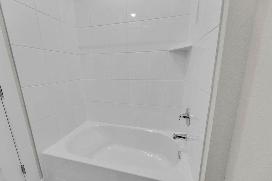 Bathroom in the Pecos home plan by Trophy Signature Homes – REPRESENTATIVE PHOTO