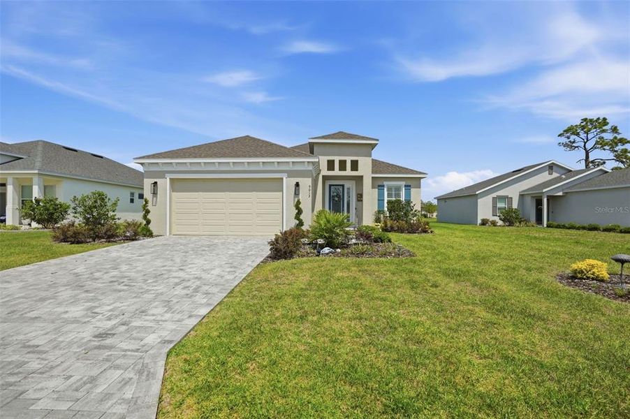 Front exterior of a new home in , Weeki Wachee, FL, highlighting curb appeal (Image 23).