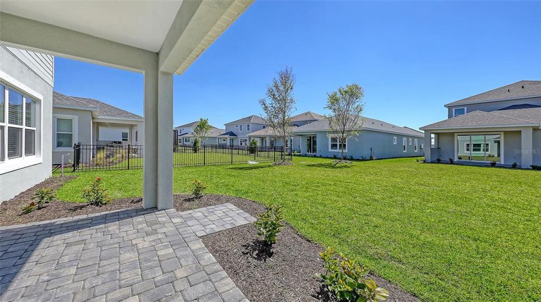 Front exterior of a new home in Wildleaf, Parrish, FL, highlighting curb appeal (Image 17).