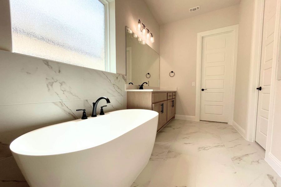 Furnished interior view inside a new home in Whisper Valley, Manor (Image 15).